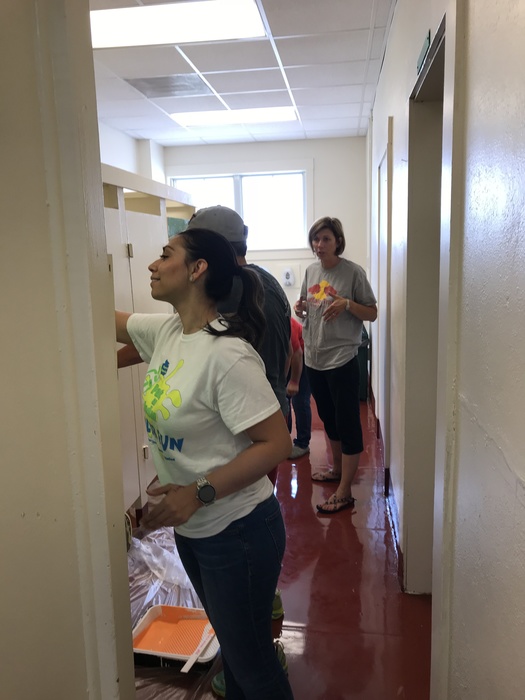 Ms. Sanchez, Ms. Welch, Ms. Merrill and Ms. Aguilar paint the boys restroom